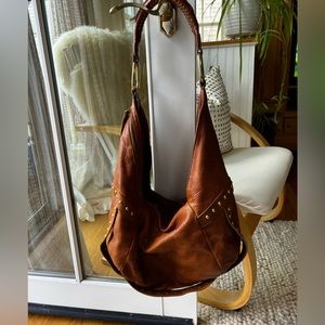 Deerskin shoulder bag with brass details.